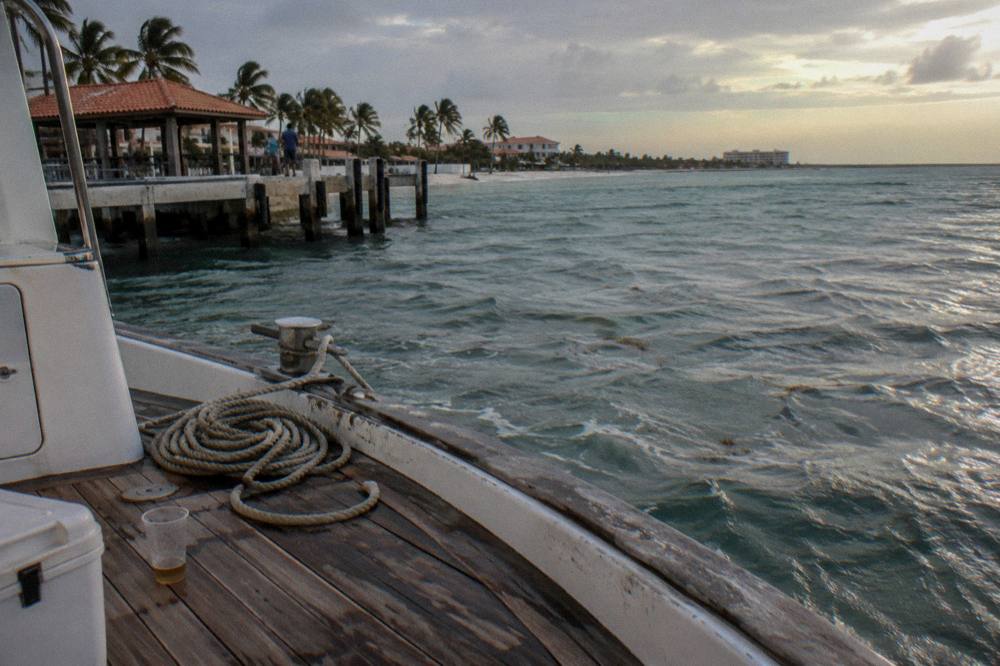 Boat deck in the last light after sunset with calm water beyond
