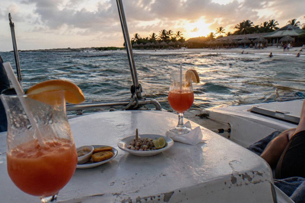 Cocktail glasses and appetizer plates arranged on a boat deck table